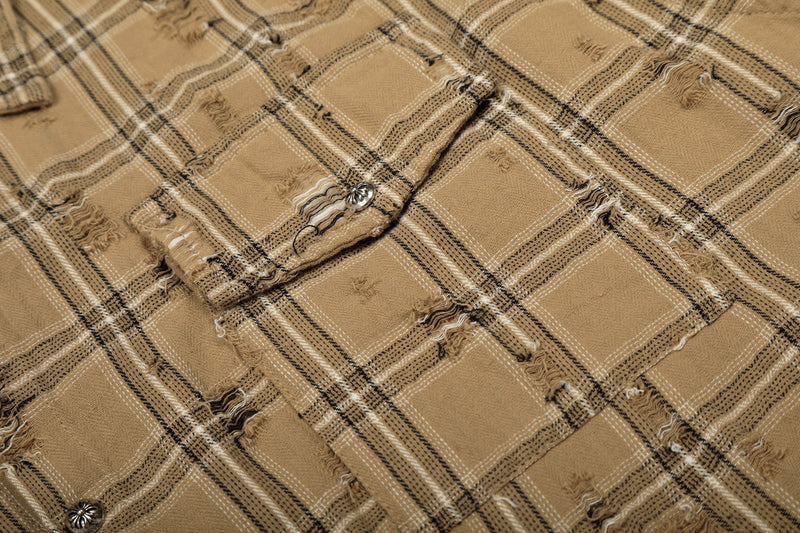 Close-up of tan plaid shirt jacket button placket and frayed fabric texture