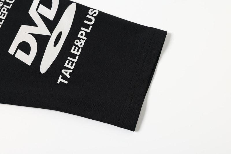 Close-up of black sleeve hem with bold white graphic print