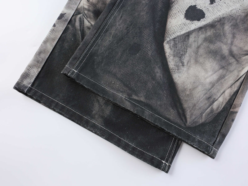Close-up of hem on dark abstract wash jeans with stitched cuff detail