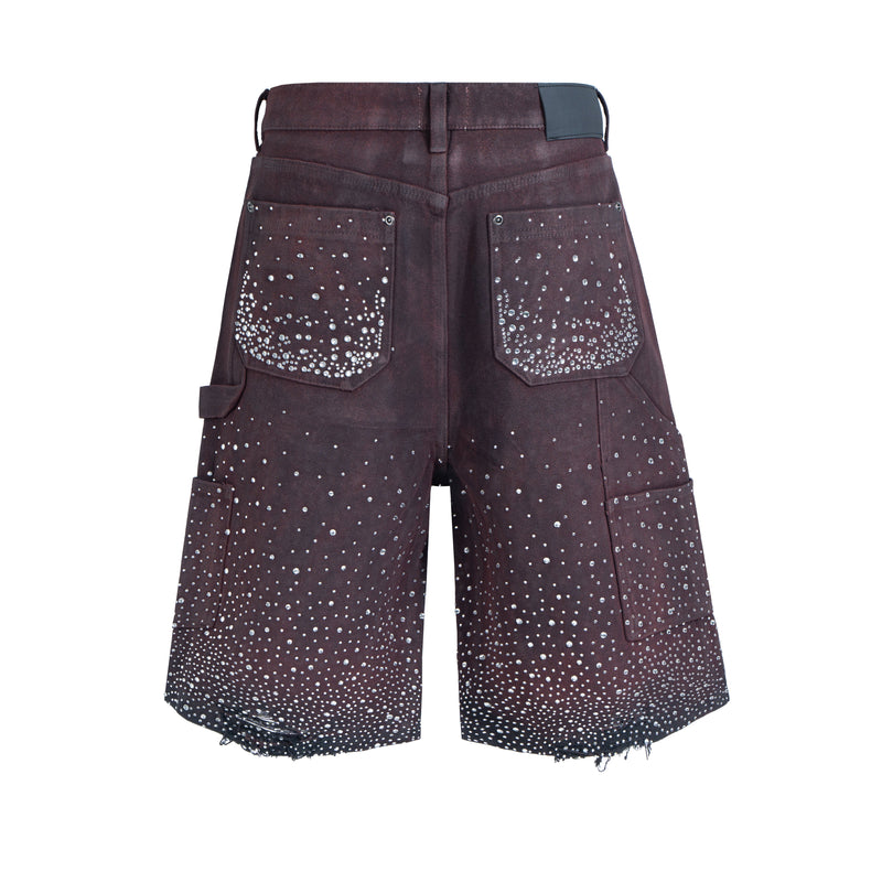 Back view of dark brown rhinestone denim shorts with cargo pockets and frayed hems
