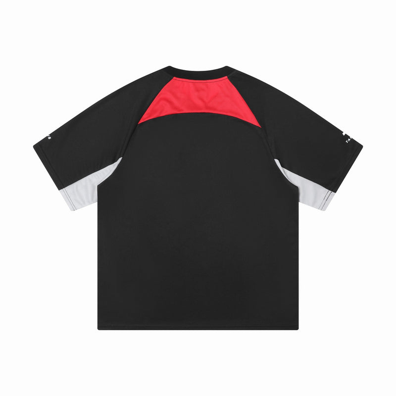 Black colorblock sport jersey tee with red shoulder panel and white sleeve accents on a clean white background