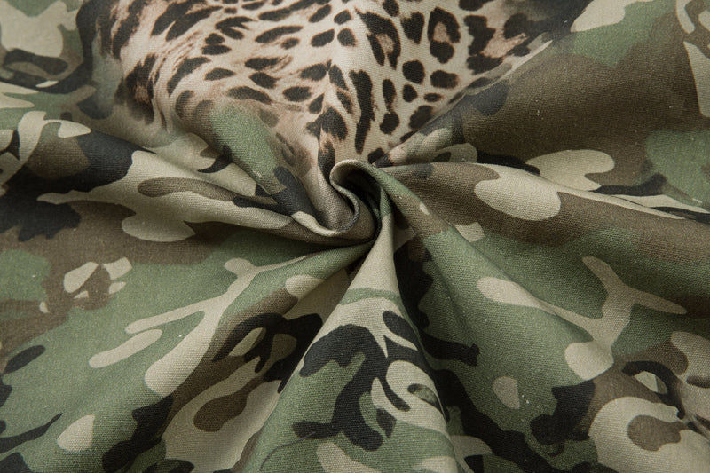 Wrinkled close-up of camo and leopard print fabric texture