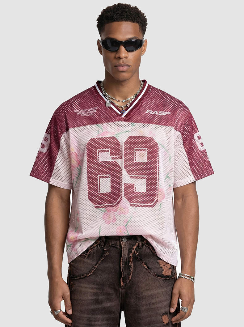 Maroon floral mesh jersey T-shirt with large 69 graphic and V-neck streetwear styling on model