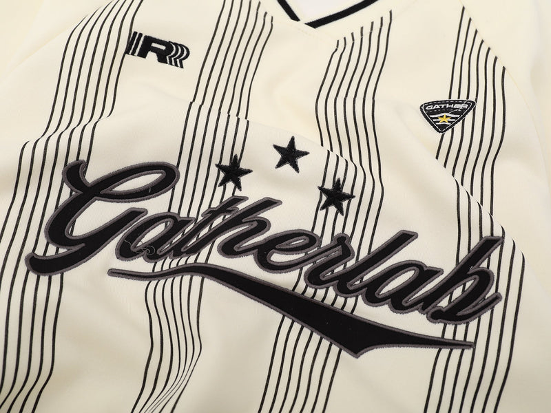 Close-up of cream sweatshirt front showing Gatherlab script and chest patches