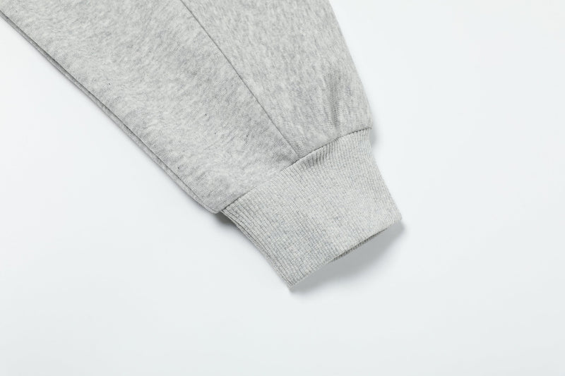 Light gray hoodie sleeve cuff close-up with ribbed knit trim