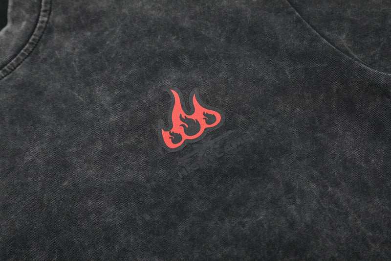 Black washed oversized cotton T-shirt with red flame graphic on the chest