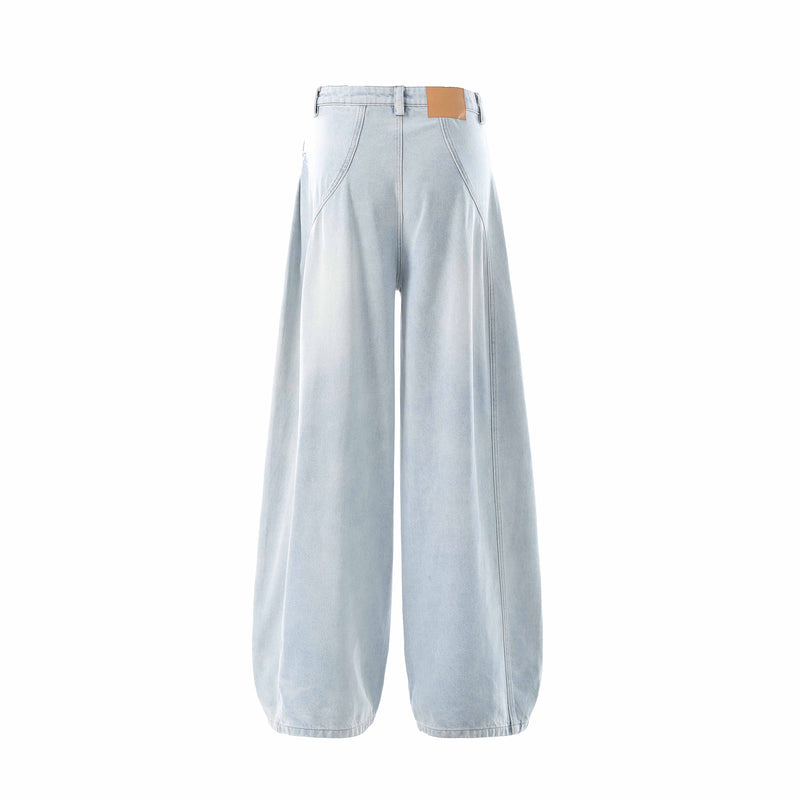 Back view of light wash wide-leg balloon jeans with tan patch waistband detail