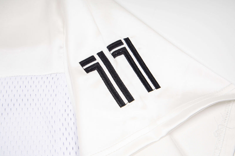 White mesh jersey tee with black number 11 graphic and breathable perforated side panel