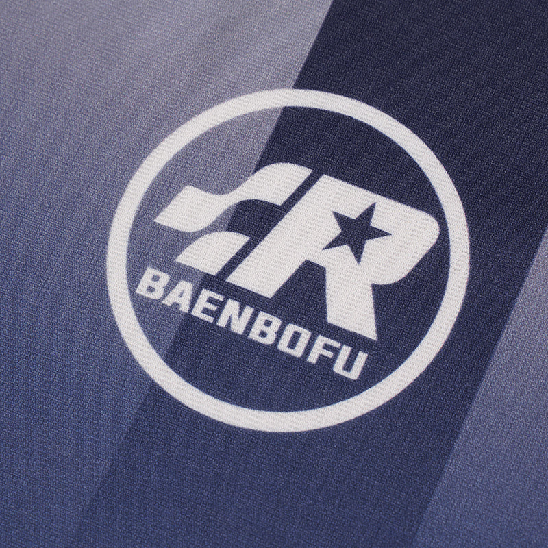 Close-up of a navy and gray gradient soccer jersey with a bold white BAENBOFU chest logo and star emblem