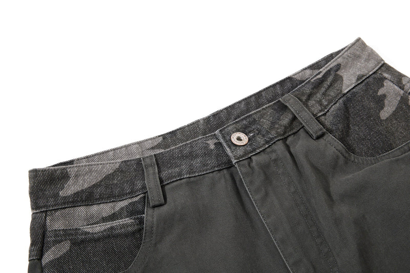 Close-up of black camo waistband with button and belt loop