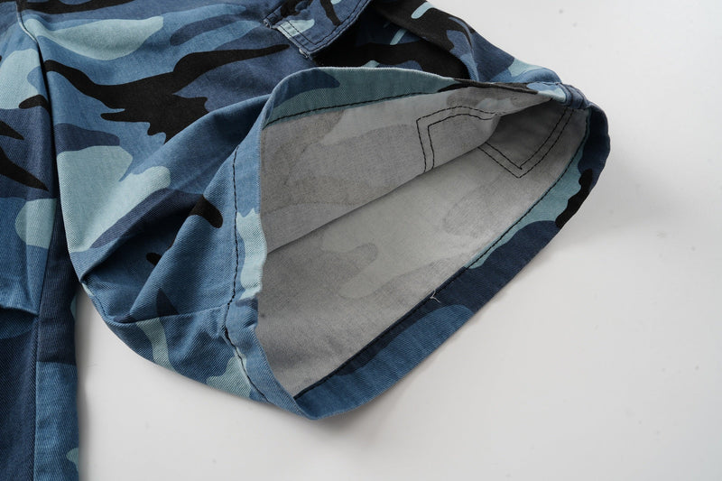 Inside leg opening of blue camo cargo shorts showing light gray pocket lining