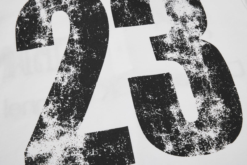 Close-up of a white streetwear polo tee with bold distressed black SK 75 graphic print