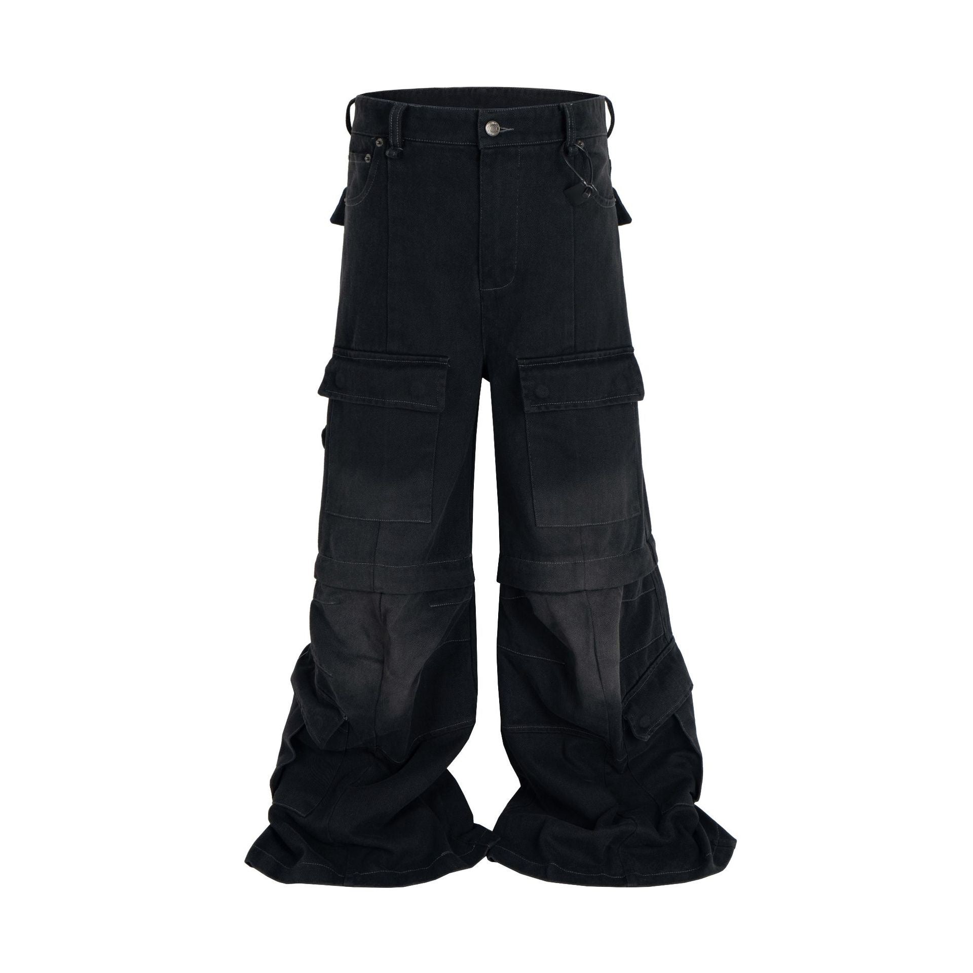 Front view of black stacked wide-leg multi-pocket cargo pants with faded denim panels and flap pockets