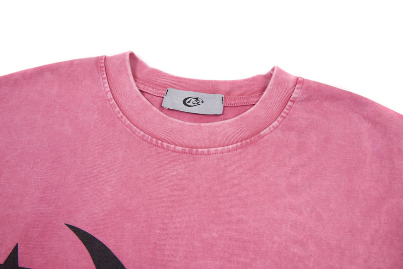 Close-up of pink crew neck tee showing inner label and soft heavyweight fabric