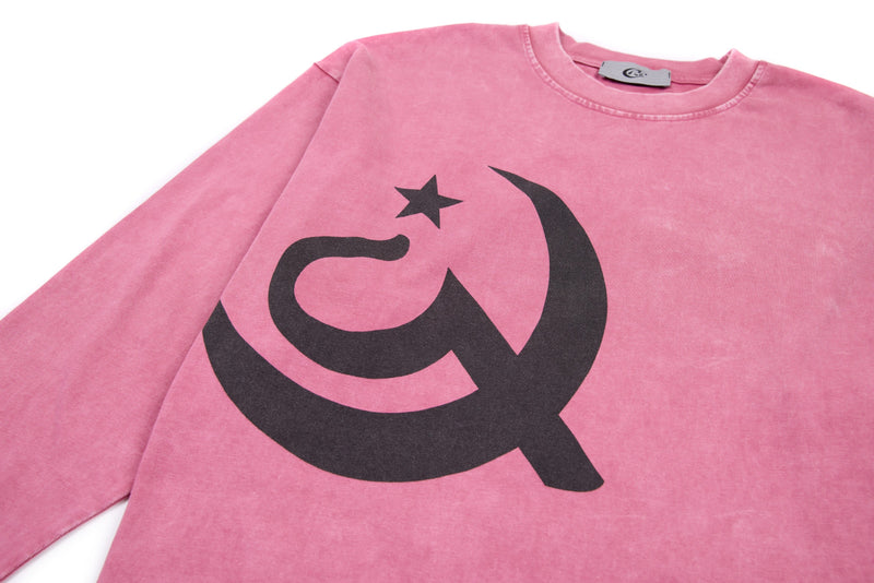 Front view of pink cropped long sleeve tee with large black graphic print