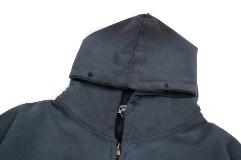 Close-up of charcoal hoodie hood and zip collar with distressed seams