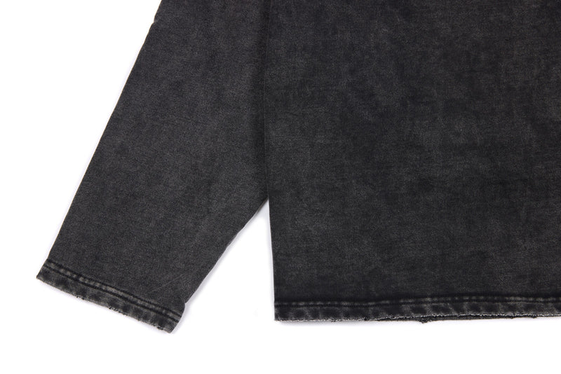 Back sleeve and torso close-up of black washed long sleeve tee