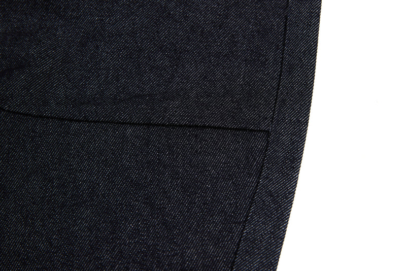 Close-up of black denim hem with clean straight stitching