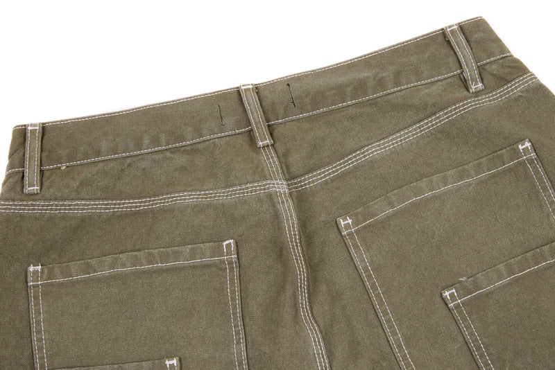 Back view of olive denim pants waistband and patch pockets with contrast stitching