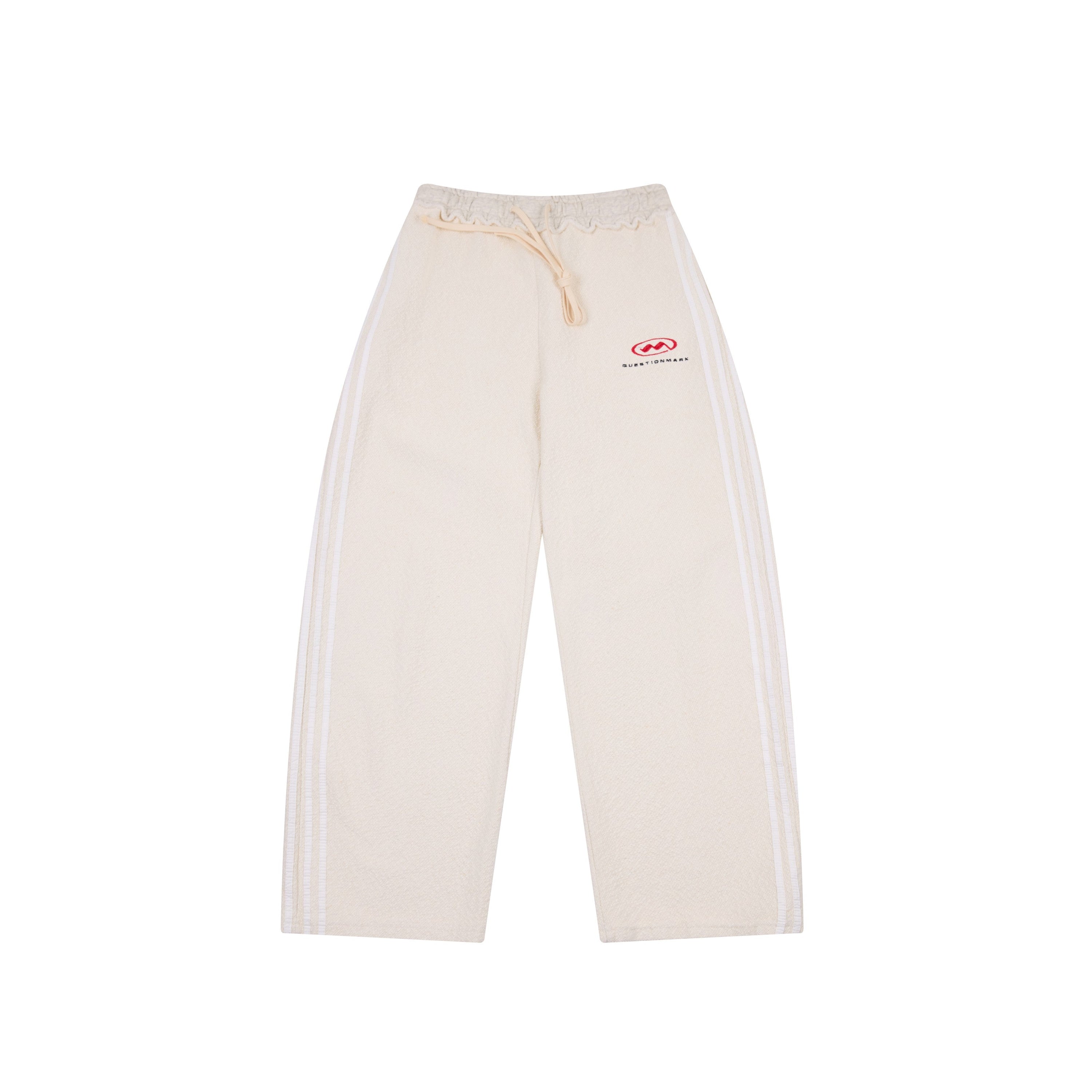 Cream wide-leg cotton track pants with dual white side stripes, drawstring waist, and small front logo print, front view