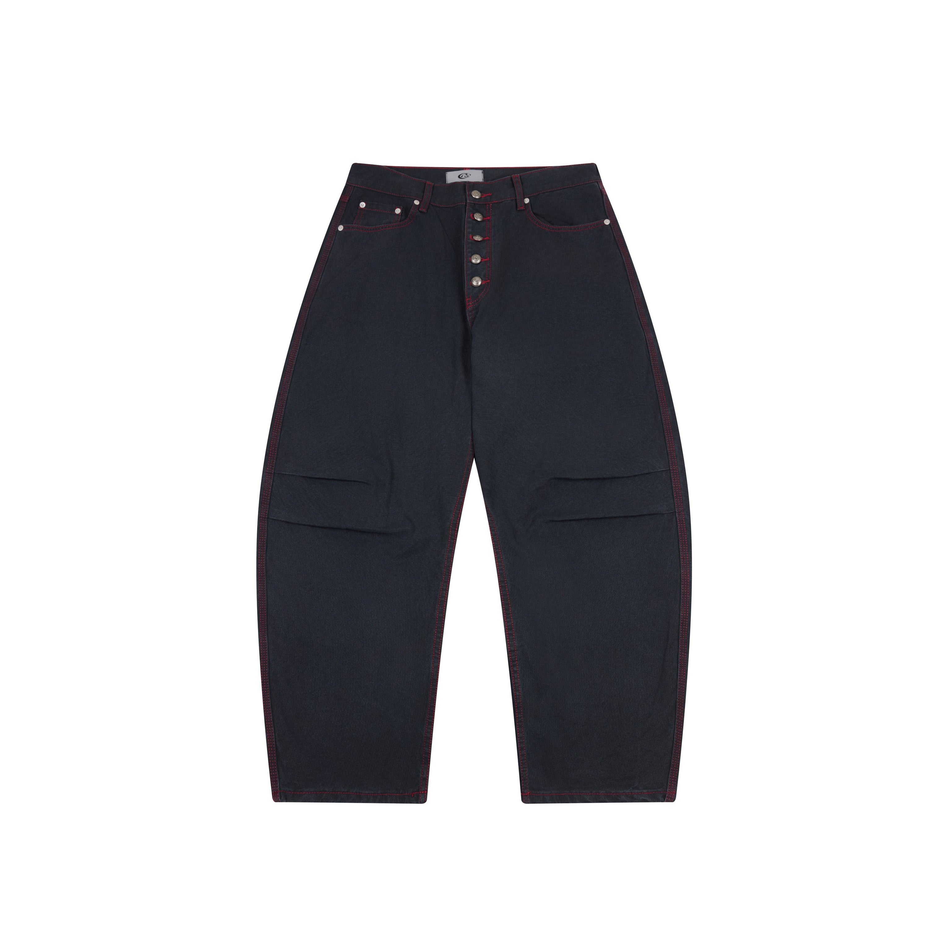 Front view of dark navy barrel-leg denim pants with red contrast stitching and button-fly closure