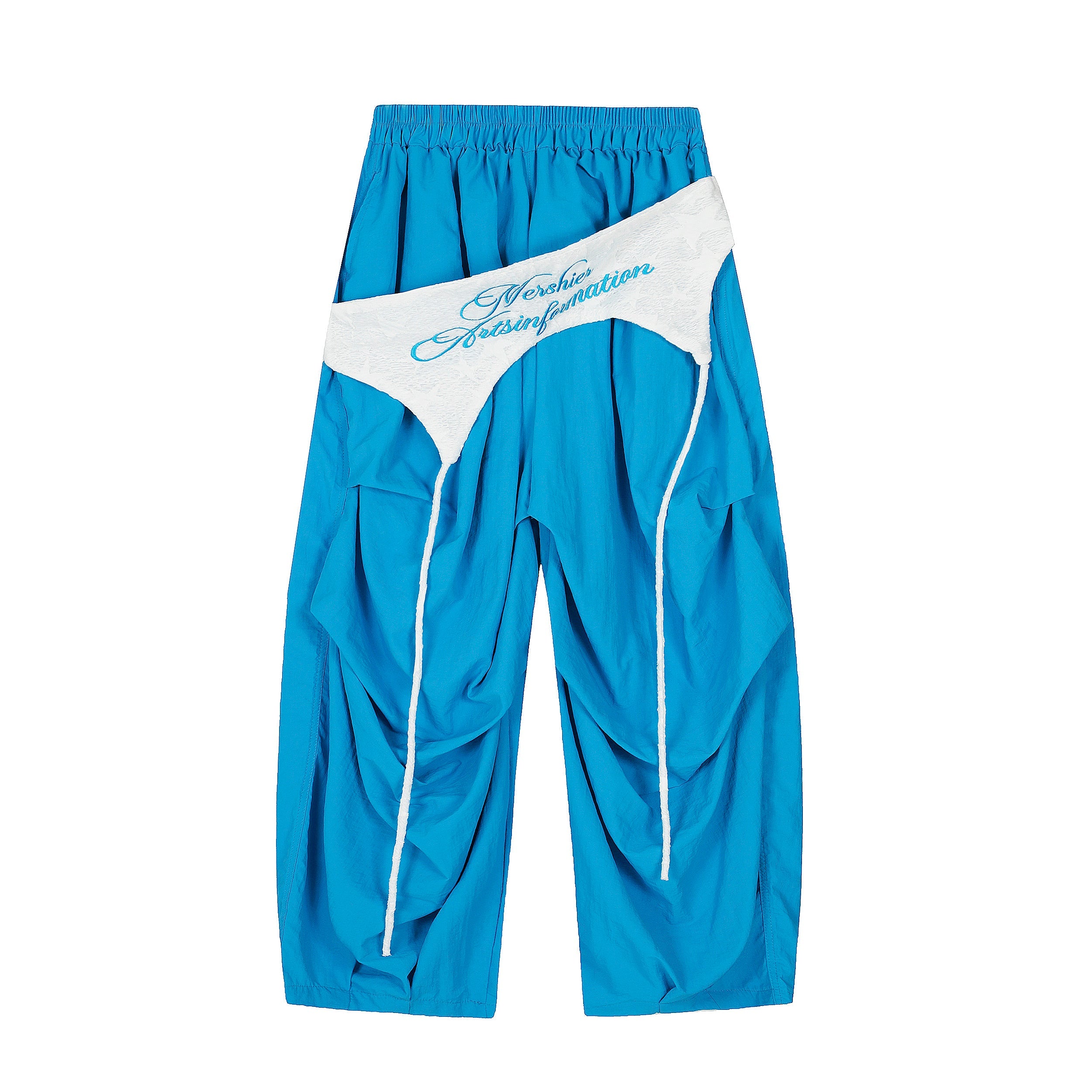 Electric blue wide-leg nylon pants with white lace detachable waistband overlay and rope piping, front view