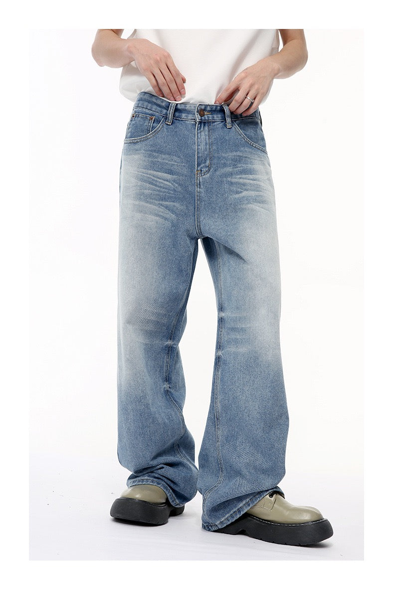 Front view of light blue wide-leg jeans with soft fade and slight flare at the hem