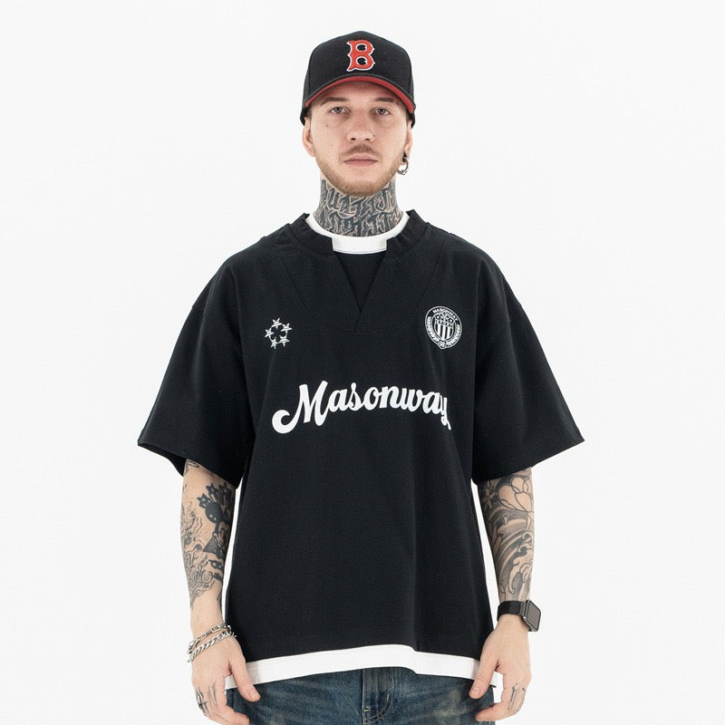 Black Masonway football tee with white script logo, V-neck collar, and streetwear soccer jersey styling