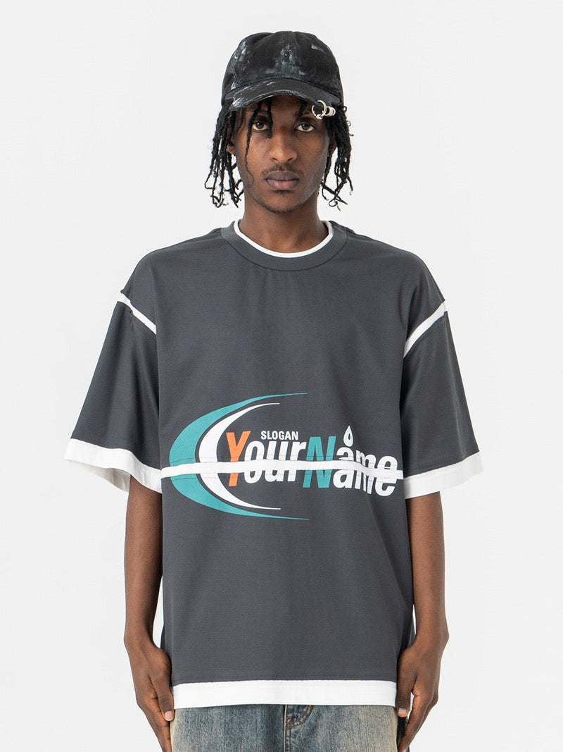 Oversized charcoal graphic T-shirt with white mesh trim and retro sports logo print on the front
