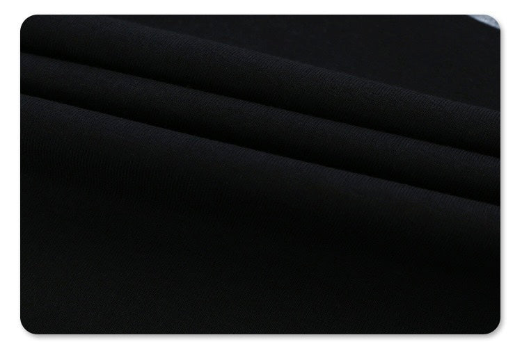 Black oversized graphic tee with subtle tonal stripes and a relaxed, minimalist streetwear look