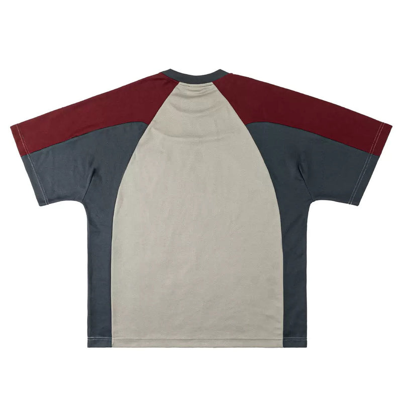 Oversized retro colorblock T-shirt with burgundy, charcoal, and cream panel design on white background