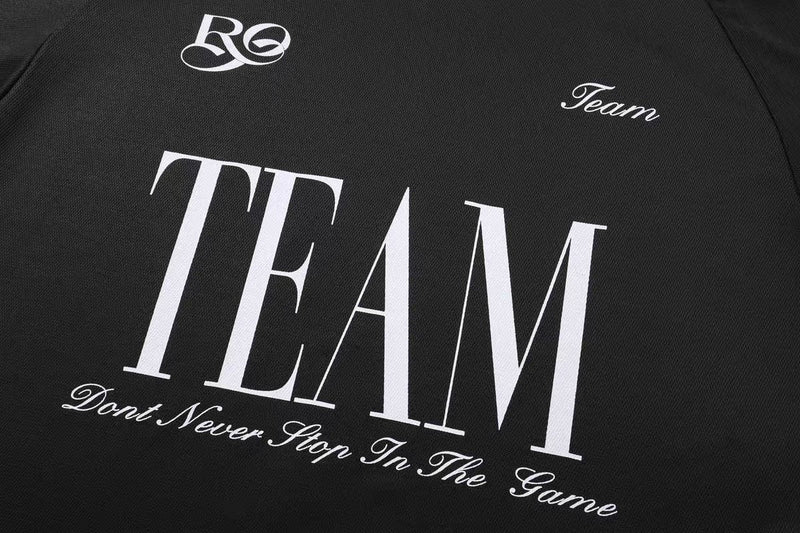 Black mesh varsity tee with oversized TEAM graphic and retro script lettering on the chest