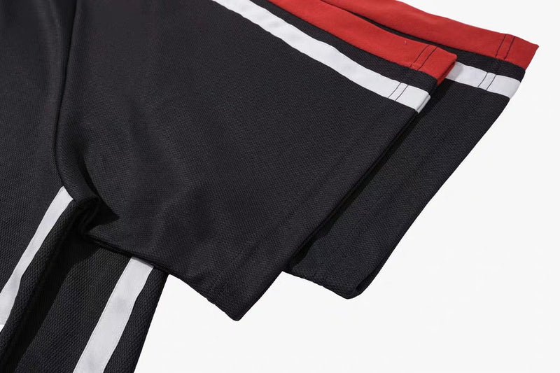 Black mesh varsity tee with red-and-white striped trim and oversized retro sportwear styling