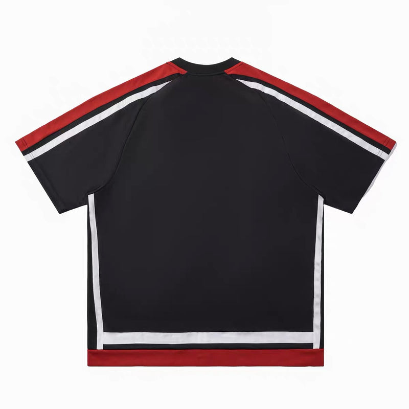 Black oversized varsity mesh tee with red and white striped sleeves and trim, shown flat on a white background
