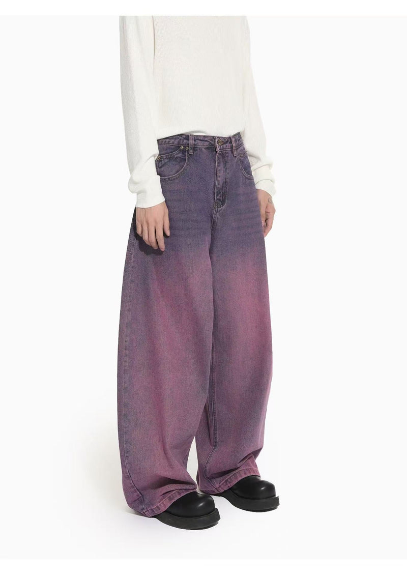Three-quarter front view of purple gradient washed wide-leg denim jeans with a high waist