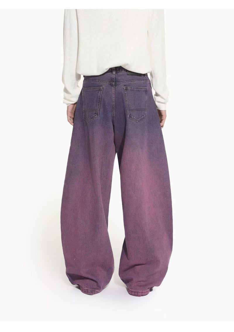 Back view of purple gradient wide-leg jeans with patch back pockets and oversized fit