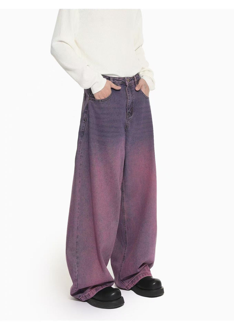 Front view of purple gradient wide-leg jeans with hands in pockets and black shoes