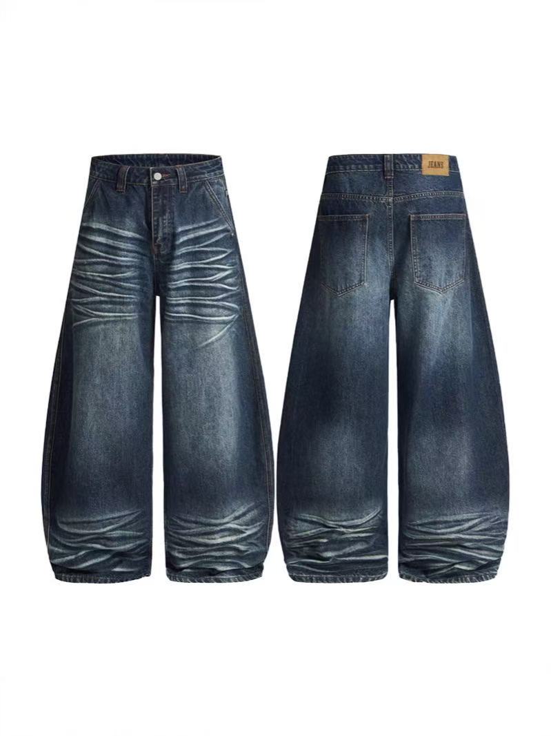 Front and back view of ultra-baggy wide-leg jeans with 3D whisker detailing and deep vintage indigo wash