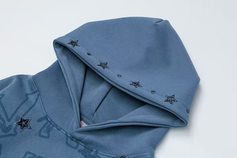 Blue hoodie hood close-up with star studs along the brim