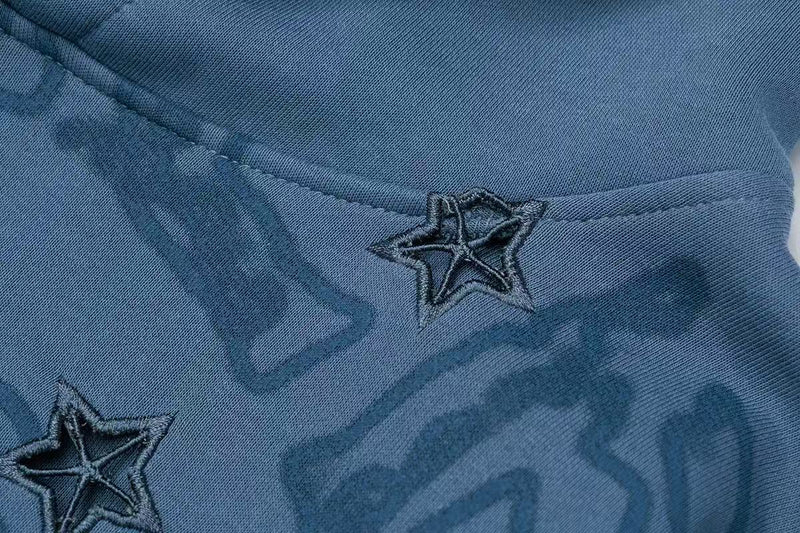Blue hoodie close-up of front chest graphic with star patch detail