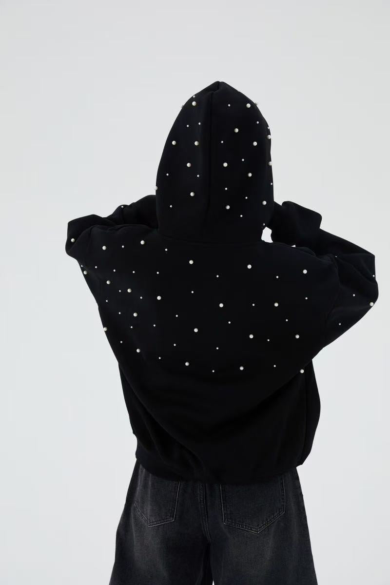 Black pearl embellished hoodie worn by model, back view with hood up