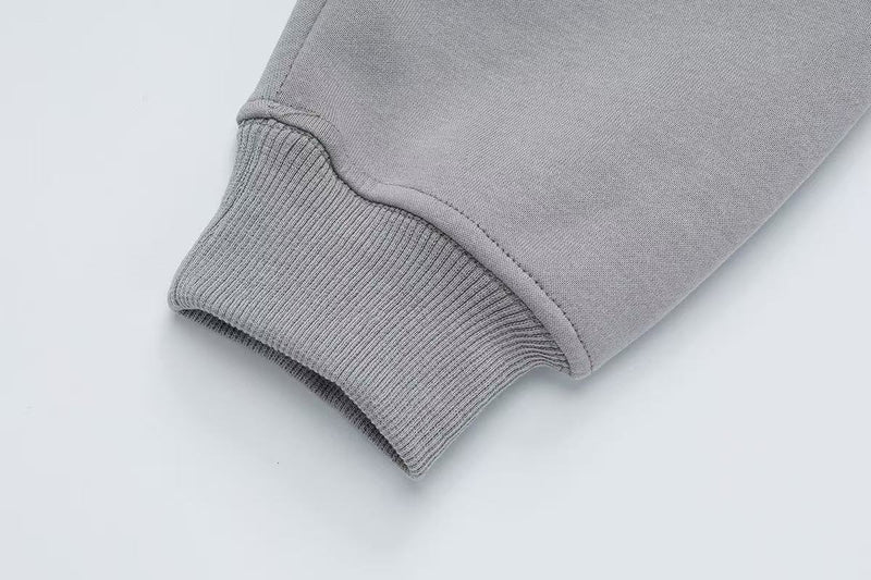 Close-up of gray hoodie ribbed cuff at the sleeve