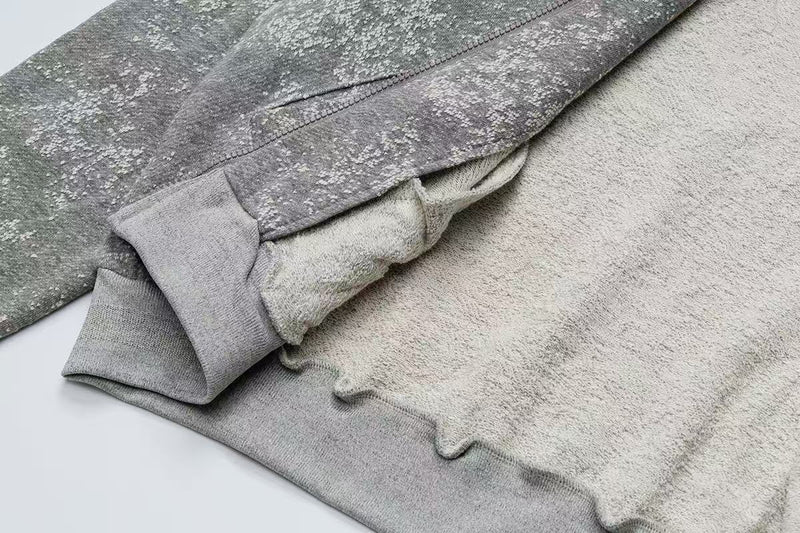 Inside view of gray hoodie with soft fleece lining and sleeve cuff