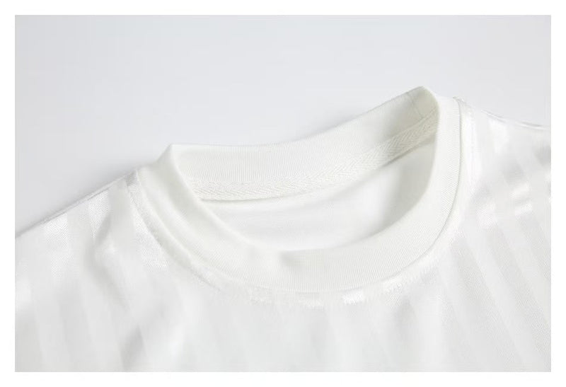 White jersey crew neckline with mesh fabric close-up