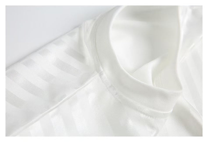 White jersey collar and shoulder seam close-up on mesh fabric