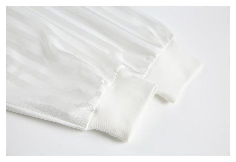 White jersey sleeve cuff close-up with ribbed knit trim
