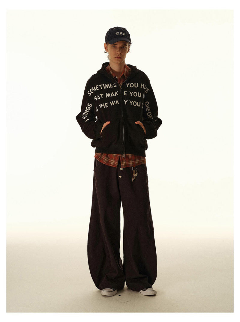 Full-length front view of black slogan print zip-up hoodie