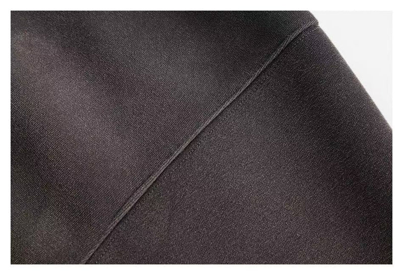 Close-up of dark hoodie fabric seam with washed texture