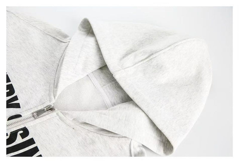 Close-up of white hoodie hood and zipper detail