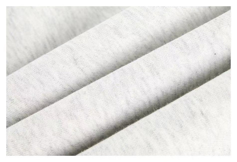 Close-up of white hoodie fabric folds and soft knit texture